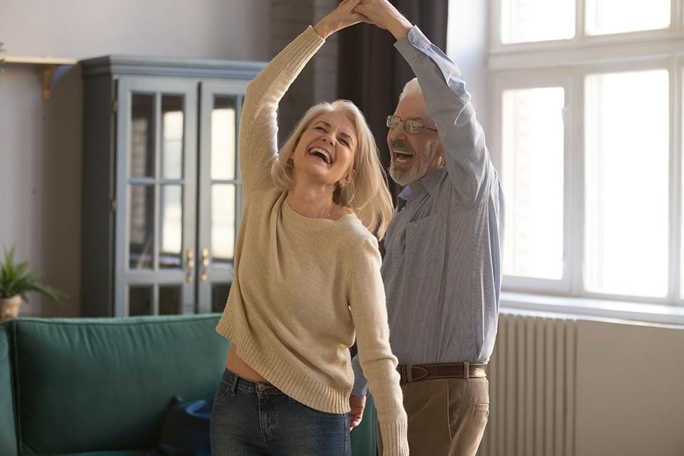 Elder couple dancing.